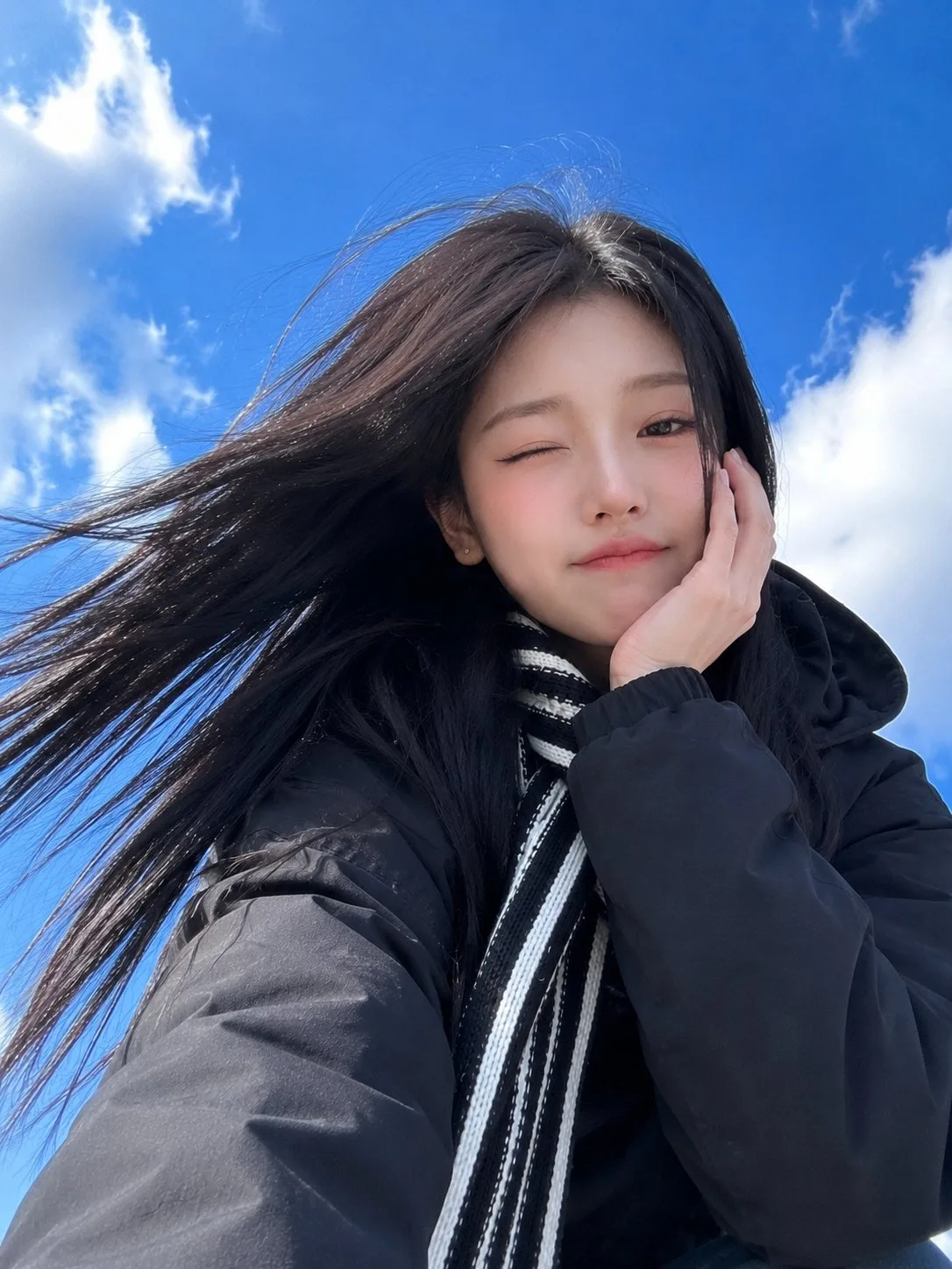 Low-Angle Blue Sky Smartphone Selfie generated image example